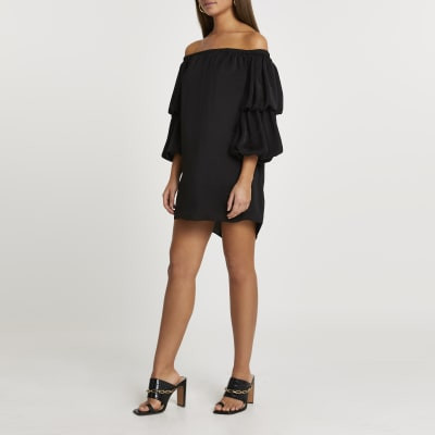 Black double puff sleeve bardot mini dress | River Island (UK & IE)