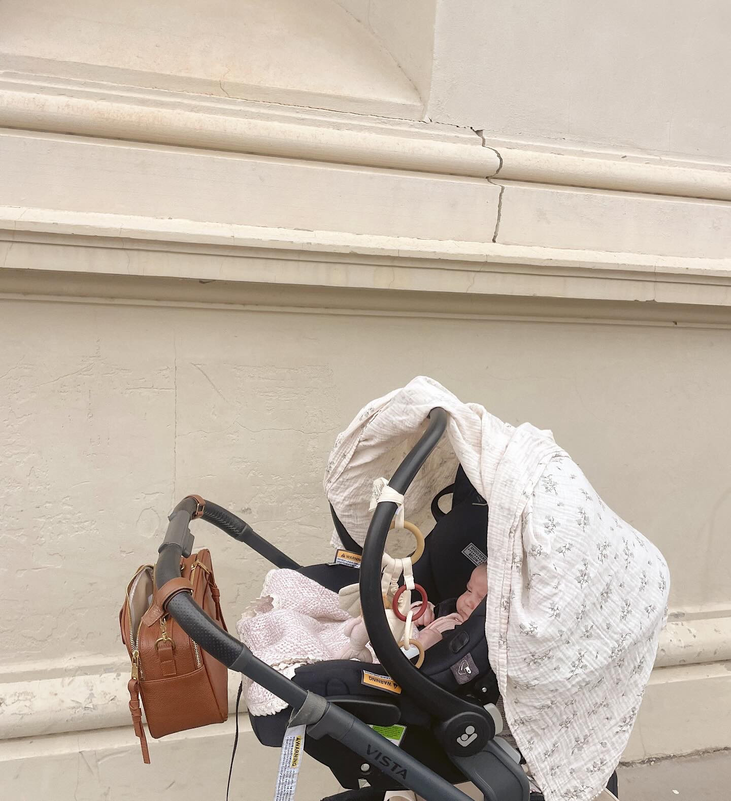 On the go essentials; 🤍🫶🏼
• @ergopouch portable sound machine ( best shhh sound out there) 
• @new.grain warm blanket of course 
• @alf_thelabel pram caddy/turns into bag for all my bits and bobs 
• @garboandfriends Muslin wrap for when she’s sleeping 
• @kongessloejd dangling toy for her to look at and try to grab!

#LTKaustralia #LTKfamily #LTKbaby