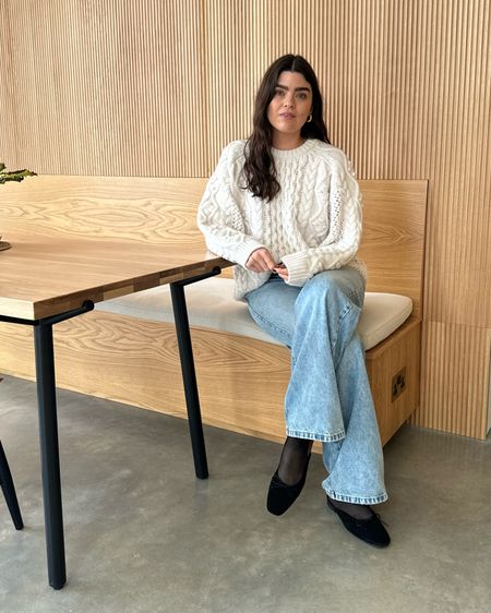 Working from home look; chunky cream cable knit jumper, light wash wide leg jeans. 

#LTKfindsunder100 #LTKeurope #LTKstyletip