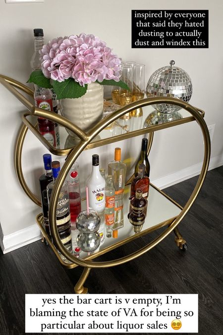 Current state of my mirrored, gold bar cart! The disco ball on the top is actually an ice bucket that I use as a candy bowl. // bar cart inspiration, ice bucket for bar cart, candy bowl, disco decor, disco balls, entertaining at home

#LTKunder100 #LTKhome #LTKunder50