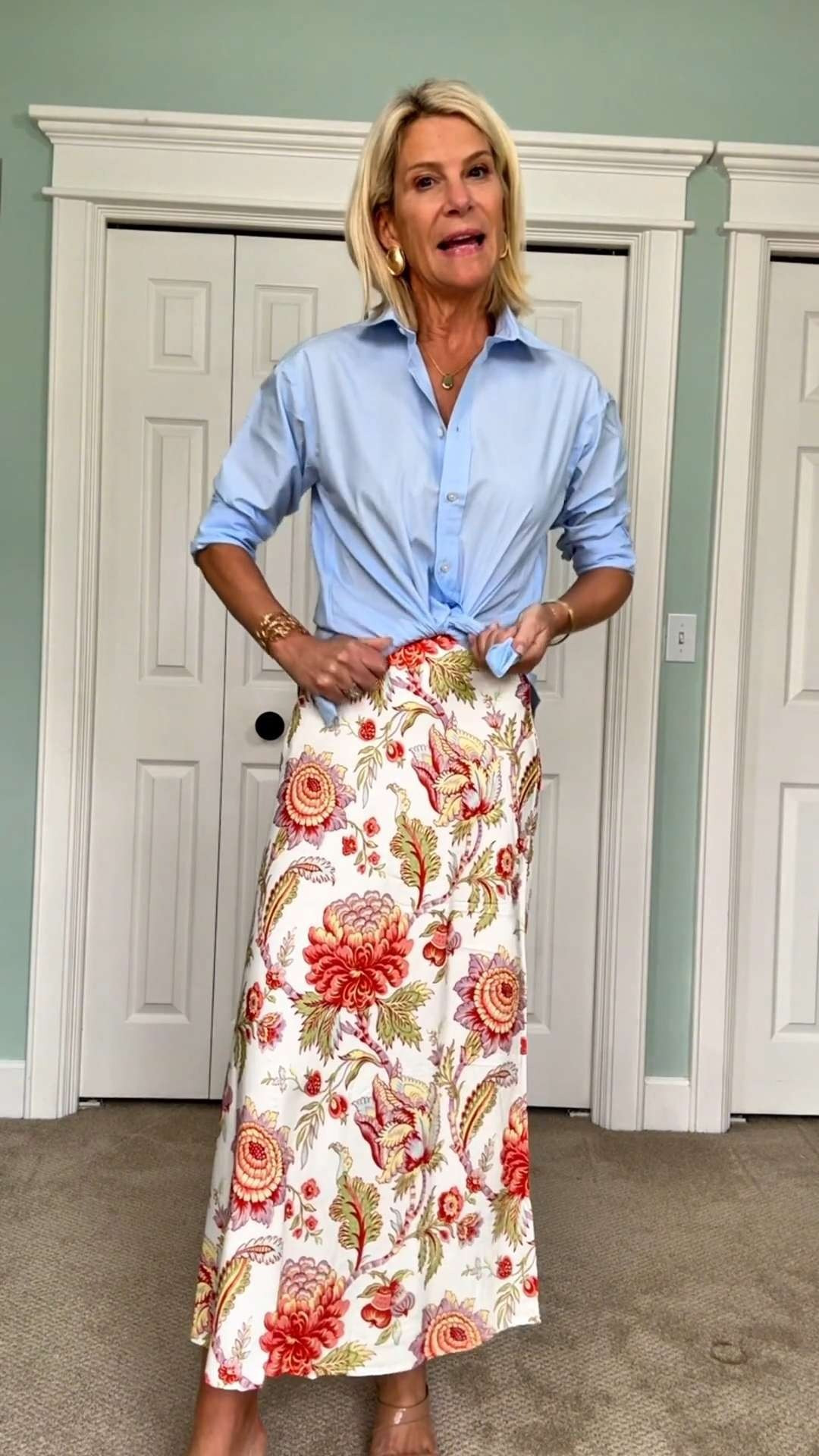 Elegant floral midi skirt styled with a blue button-down shirt and neutral heels. 

 #LTKootd #LTKSeasonal #LTKOver40