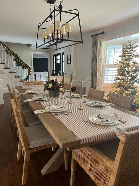 Our holiday table all dressed up. Easy hack: roll out some beautiful wrapping paper as a table runner to make it festive 

Table color: Seadrift 
Chair: chalk seat cushion 

#LTKHoliday #LTKhome #LTKparties
