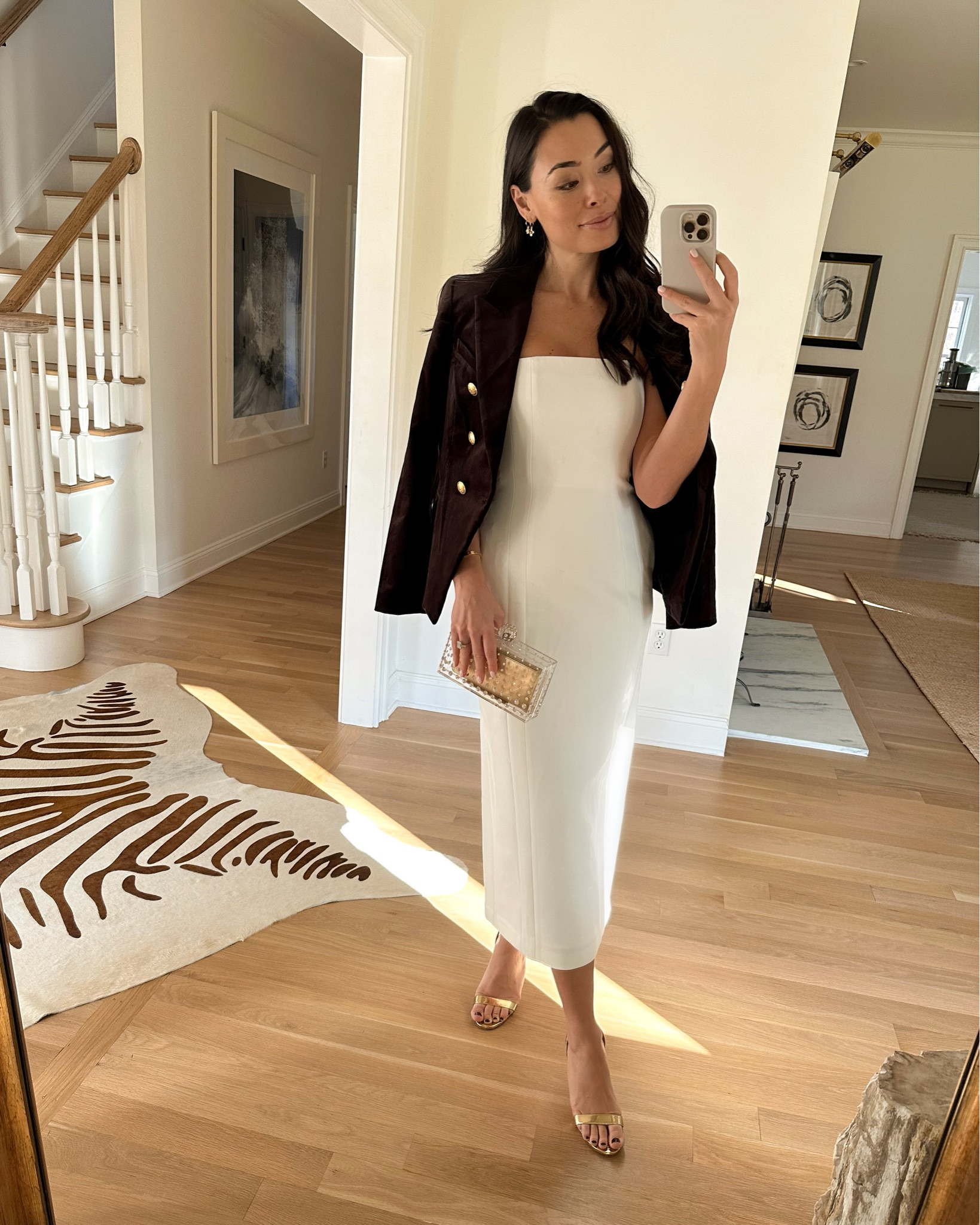 Kat Jamieson wears a white strapless dress and velvet blazer. Holiday outfit, Christmas, cocktail party, gold heels. 

#LTKHoliday #LTKshoecrush #LTKSeasonal