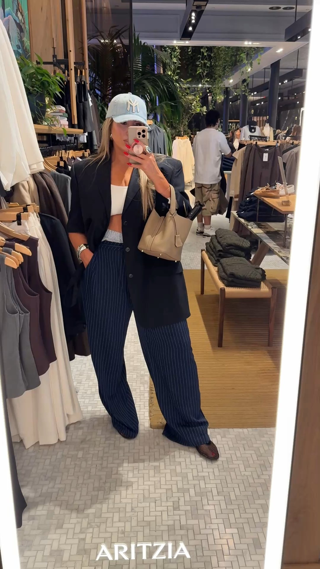 NYFW Outfit 

blazer and hat from: shopiammi.com (can’t link here) search the site for:

Pinstripe Dark Cut out Vintage
Blazer  size L/XL 
Light blue denim yankee hat 

Pants from FashionNova.com (can’t link here) search site for “Nathalie Double Waistband Pinstripe Trouser”. I sized up to a 1X for extra baggy look.

shoes (soooo comfortable), bag, white ribbed sports bra (sz L) and accessories all on amazon. I linked everything. 

makeup:

earrings are zara (sold out) but I found an exact pair on Shein

Fashion Nova outfit ( can’t link here ) search the site for Mea Gauze Pant Set - White size XL (runs true to size)

Holy Grail Makeup:

 FOUNDATION 
Haus Labs 270 (spray tan color)

CONCEALER
Kosas concealer 1.5 (I like it very bright) 

concealer set with:
setting powder: Kosas Cloud Translucent Candy (amazing)

CONTOUR/BRONZER/BLUSH
Contour: Makeup By Mario SoftSculpt Transforming Skin Enhancer in Medium

Bronzer: Hourglass Radiant Bronze Light

CHEEKS: I use 3 products layered listed below

Patrick Ta blush duo in color:

Patrick Ta blush duo in color:
she’s blushing 

then liquid highlight on very top of cheekbone Dior in color "pink"

Dior highlight quad. I use the pink shade over the dior liquid highlight (listed above) 

LIPS
Mac Stone Liner smudged out with 
Clarins color: rosewood

setting spray : One size Melt 

lash: go getter 

#LTKNYFW #LTKBeauty #LTKStyleTip #LTKMidsize