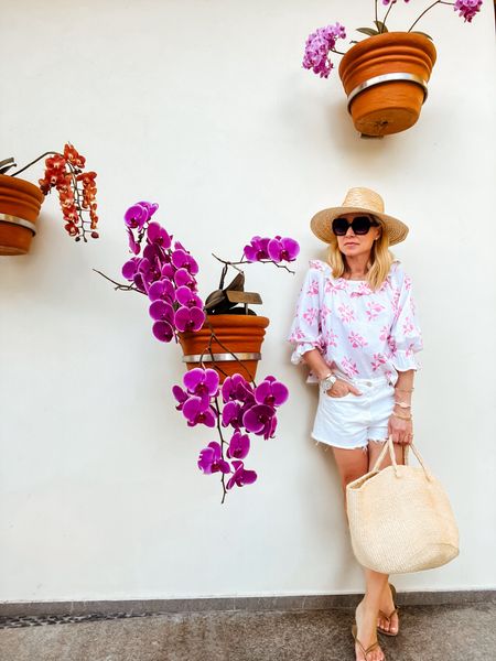 Floral cotton top + white cutoffs jean shorts = easy vacation look

#LTKSeasonal #LTKtravel