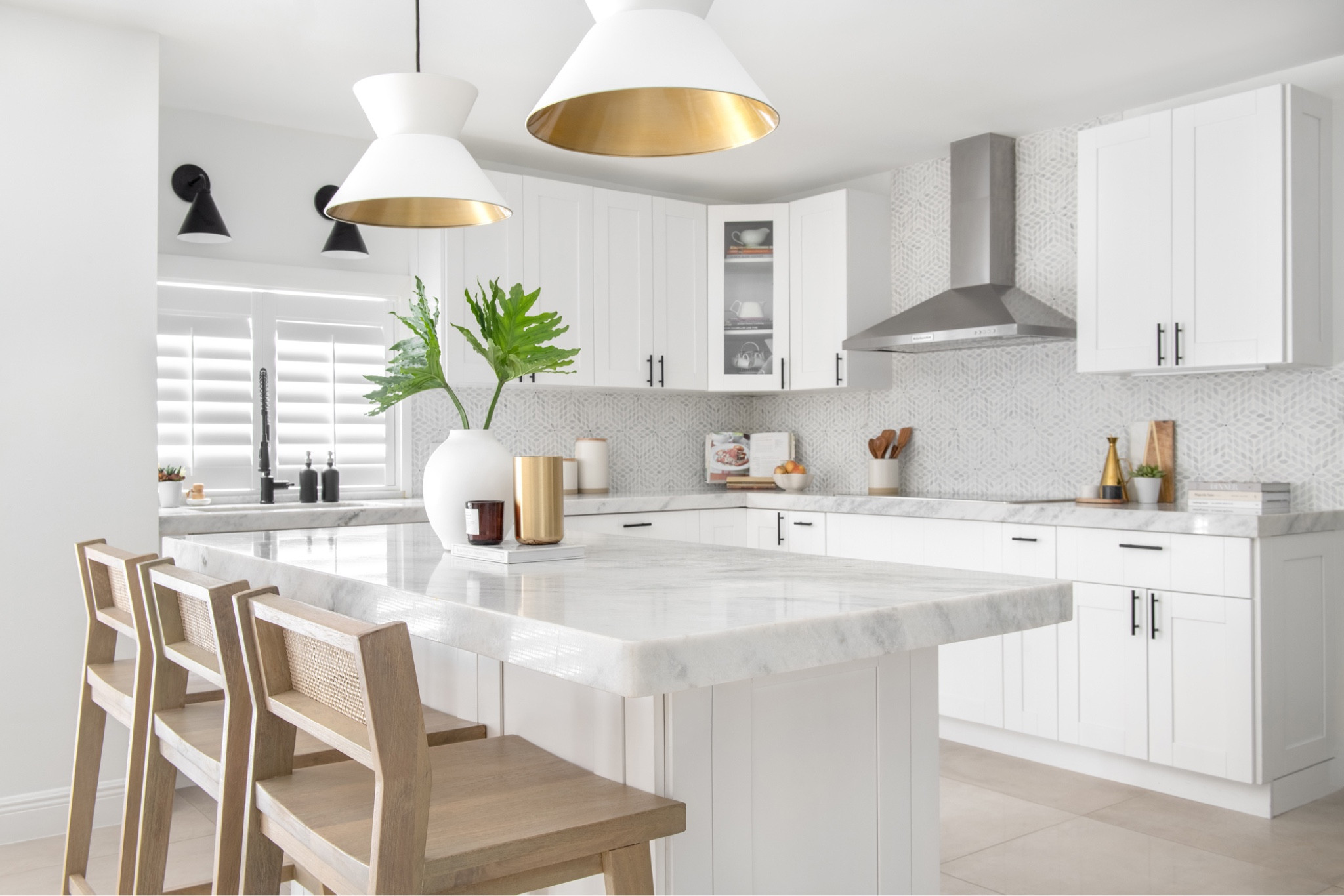 This Palmetto Bay, Florida, underwent a breathtaking coastal modern transformation. We updated the kitchen with a star-patterned honed marble backsplash and complemented it with a Calcutta marble countertop and mixed-metal fixtures and pulls for a bold contrast. In the guest bathroom, we added an oak vanity with geometric floor tile and ceramic glazed wall tiles. The kids' bath got a moody blue vanity and subway tiles. This family and dog-friendly home transformation is nothing short of paradise. #timeless #sophistication #kitchenbanquette #remodel #kitchenremodel #guestbath #kidsbathroom #marblecountertop #mixedmetal #bolddesign #interiordesign #homedesign #customvanity #bluevanity #moodybathroom


#LTKfamily #LTKhome