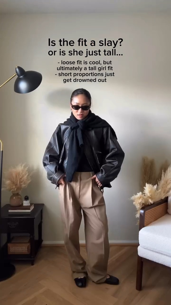 What did you think of my Leo impression ?🤭 | Anyways girls today we are testing leather over a pair of neutral LOOSE-fitting trousers and a tie over sweater. I’ve been seeing loose-fitting suiting EVERYWHERE especially on Pinterest lately and sad to say that 1. It’s not really my personal style and 2. This trend does NOT favor the short queens. Ruling this one out as a tall girl fit, better luck to me next time! 🙅🏻‍♀️ 

🔗 Outfit specifics always linked in bio → LTK @amandacapsulewardrobe
⸻

#pinterestoutfits #petitestyle #capsulewardrobechallenge #leatherjacketstyle #recreatingpinterestoutfits recreating Pinterest outfits, recreating influencer outfits, is it the outfit or is she just tall, Pinterest outfit inspiration, chic minimalist style, capsule closet inspiration, how to style a leather jacket, viral zara leather jacket, how to style funnel neck jackets, minimalist style, effortless looks, recreating celebrity outfits, leather bomber jacket recommendations, short girl styles, petite styling, 5’2” height, does this outfit work on short girls