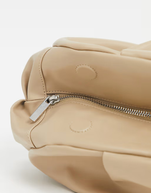 ASOS DESIGN oversized ruched clutch bag in beige | ASOS | ASOS (Global)