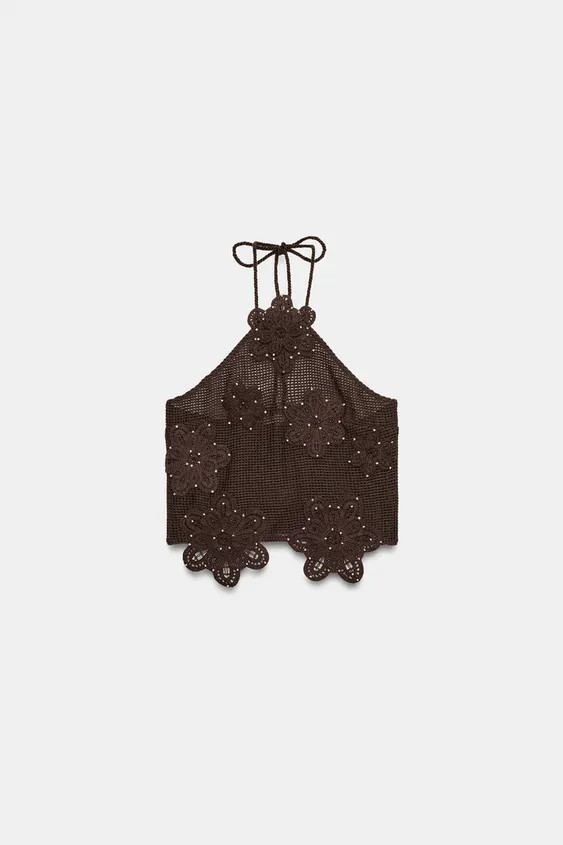Model height: 183 cmHalter neck top with tie fastening. Structured fabric with flower motifs and ... | Zara UK