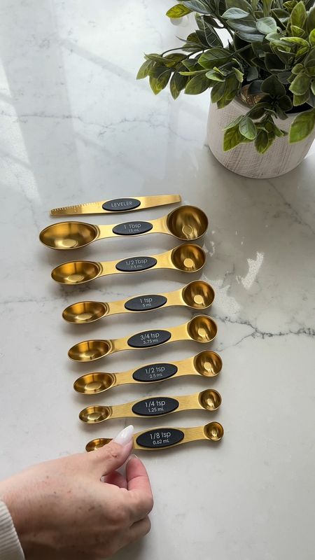 These kitchen gadgets make cooking and baking much easier. I love these gold, magnetic measuring spoons. This garlic peeler works like magic! 

#LTKFindsUnder50 #LTKHome #LTKVideo