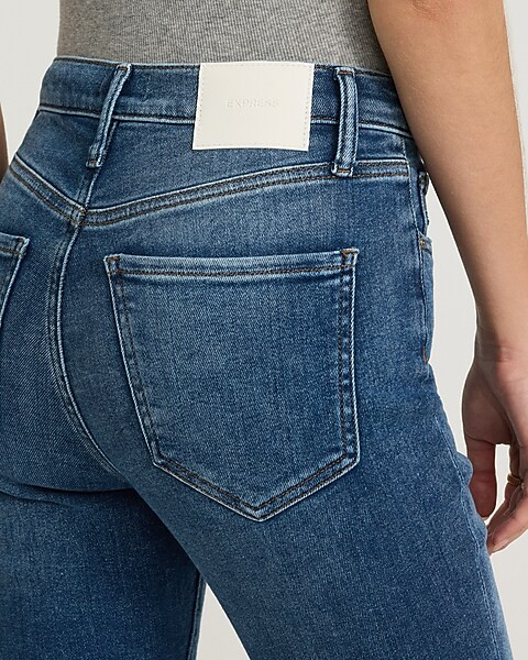 High Waisted Medium Wash Raw Hem Cropped Flare Jeans | Express