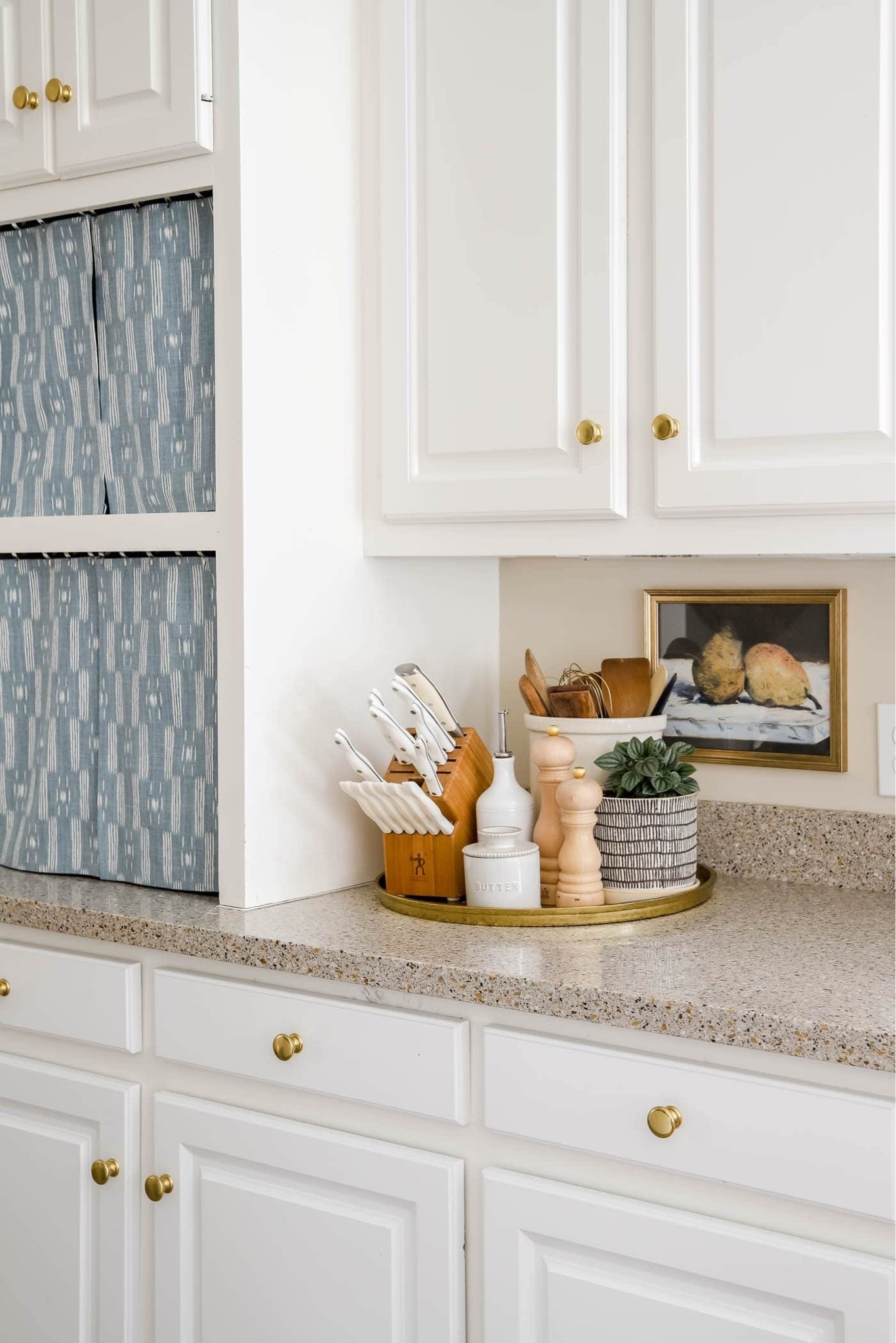 I love corralling my utensil canister, knife block, oil cruet and salt & pepper shakers in a tray on my kitchen counter!

#LTKHome
