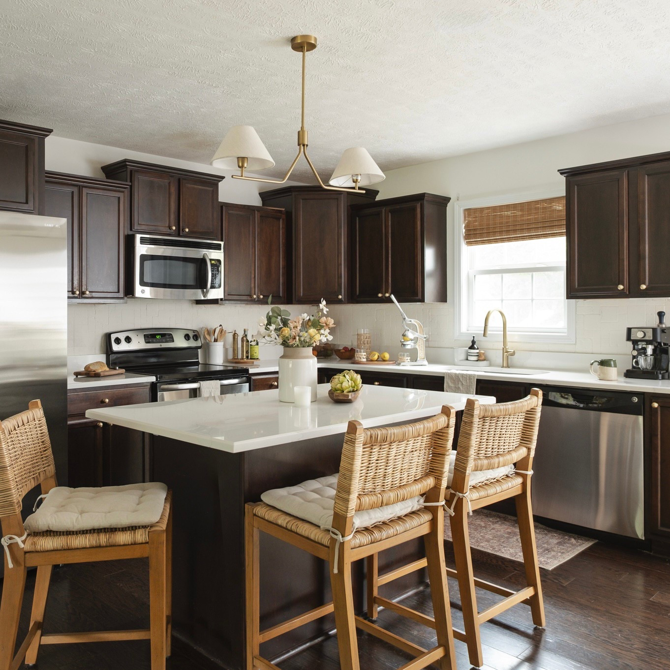 loved what we could do with a veryyy small budget. 😂 a few fixture updates, quartz countertops & decor for this little kitchen update. #LTKhome