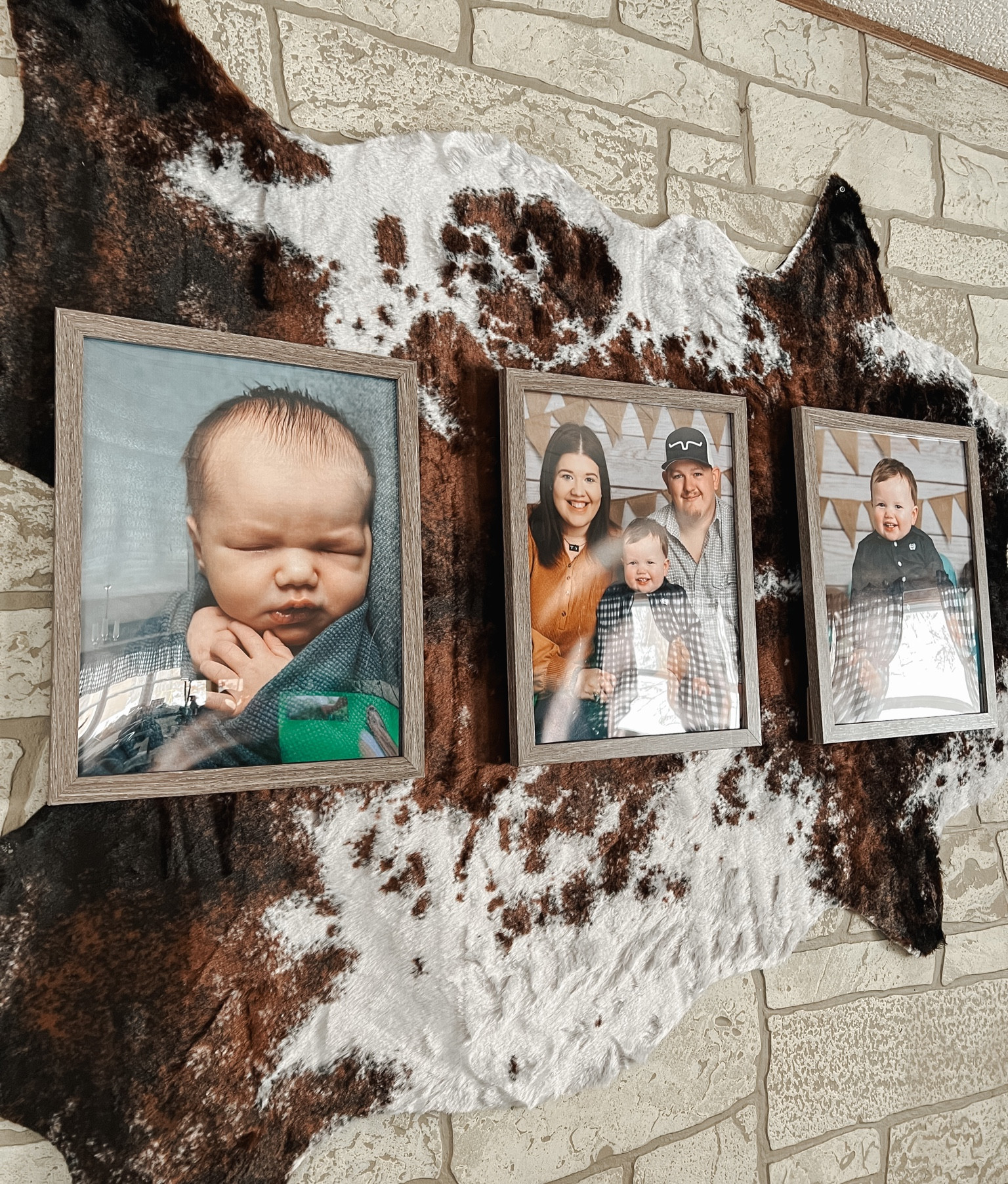 I’m obsessed with this accent wall in our living room! Nothing better than some cowhide & your favorite family photos 🤍 

Cowhide rug from the photo is from The Broken Cactus Co — www.thebrokencactusco.com 
#Cowhide #WesternDecor #WesternLiving #WesternHomeDecor #CowhideArt #Cowprint #FamilyPhotos #CowhideLover #Western #Country #Livingroommakeover 

#LTKfamily #LTKFind #LTKhome