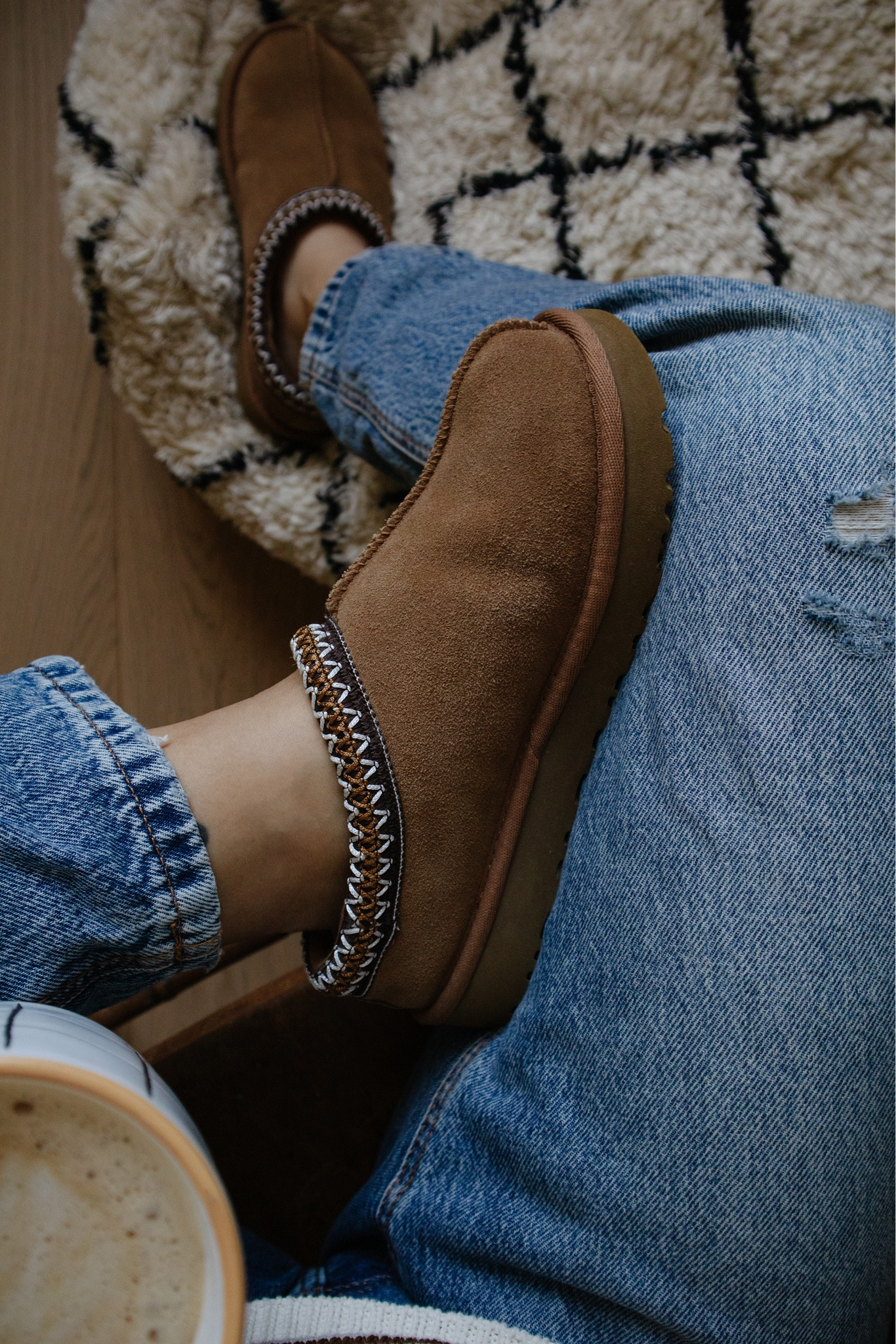 These slip-on beauties are like a warm hug for your feet. I've always been a fan of the classic Ugg boot, but the Ugg Tasman takes it to the next level with its added versatility. The exposed stitching and Tasman braid detailing give it a subtle boho vibe that I absolutely adore. These were the it Ugg shoe last season, and I expect they will continue to be the hottest option this Fall as well.

Wearing a size 7.


#LTKSeasonal #LTKStyleTip #LTKShoeCrush