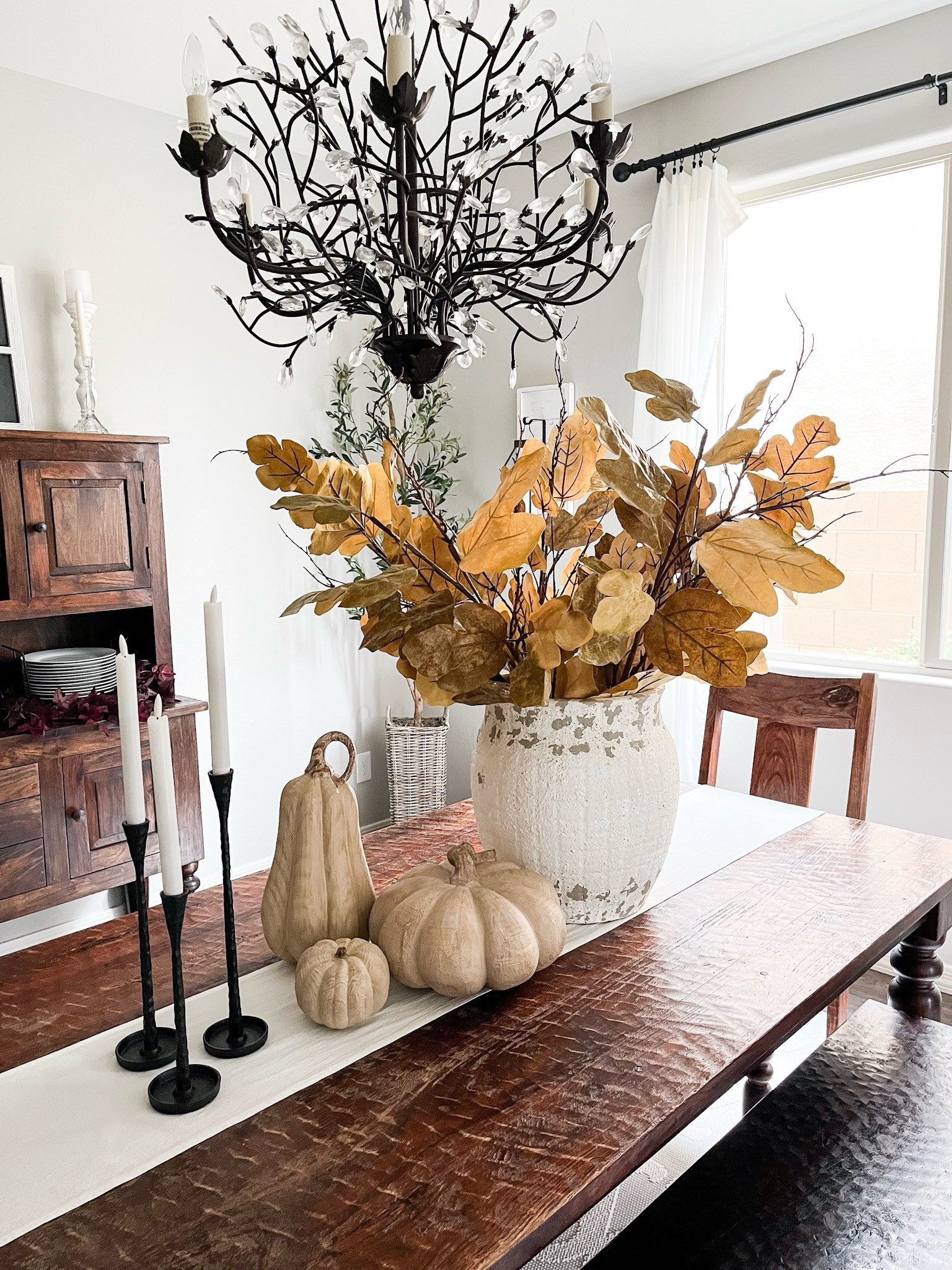 Fall table styling with this absolutely amazing vase and gorgeous fig leaf stems! The stems are huge and come in a set of 6, definitely my favorite this season!! I also added these beautiful faux wood pumpkins and iron candlesticks to complete the look!

Handcrafted terracotta vase | fig leaf faux stems | faux wood pumpkins | iron candlestick holders 

#LTKHome #LTKSeasonal #LTKStyleTip