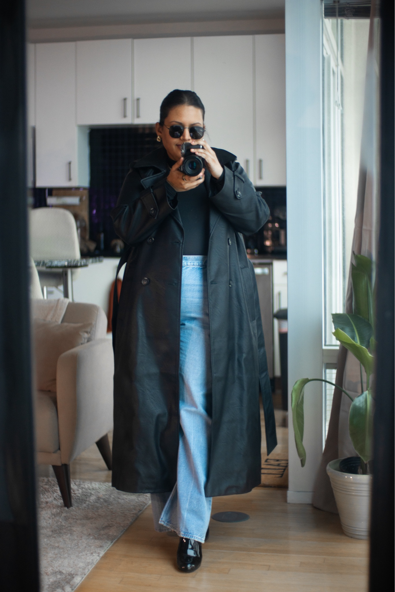 Plus Size Winter Fashion: Leather Trench Coat. This plus size winter coat gives this look an edgy twist in the winter months. A staple, go to look for the winter months. This Abercrombie Leather Plus Size Trench Coat gives this an edgy twist for winter wear. Paired with a high rise wide leg jeans in a light wash, and a black turtleneck. Accessorize with black sunglasses and booties to complete the look. 

#LTKSeasonal #LTKmidsize #LTKplussize