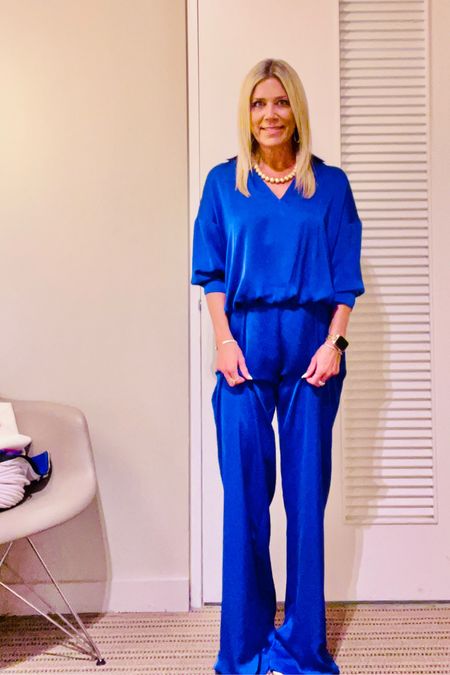 Matching sets are trending and who wouldn’t love smiling into this vibrant Capri blue satin top and wide-leg pants. The pants are tailored or fitted at the waist and hips. Dress this for summer with high heel sandals and a white bag. Then transition to fall with a jean jacket and loafers or heels.

#LTKFind #LTKstyletip #LTKunder100