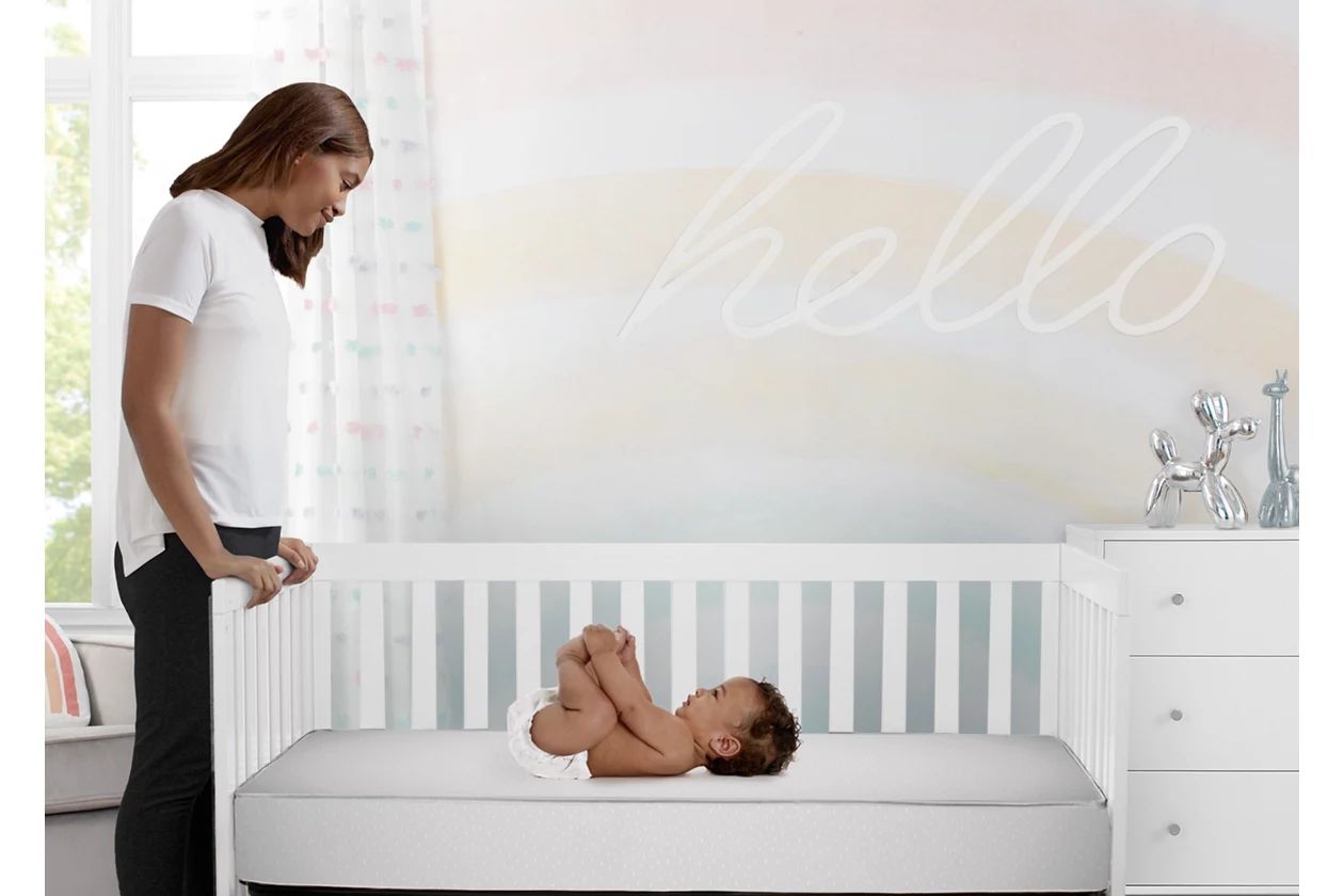 Delta Children x Ashley Furniture Peaceful Dreams Dual Sided Crib and Toddler Mattress | Ashley Homestore