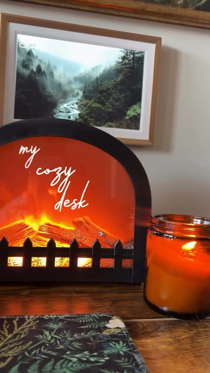 Absolutely loving my faux fireplace, candle, and digital frame running in the background like a mini Frame TV (minus the TV lol). It’s a small setup, but it makes sitting down to work feel so happy and productive on a cold winter day 🖤

#cozycore #cozycontent #cozyaesthetic #cozylifestyle
#cozyhomevibes #homebodylife #slowathome #quietmoments #softliving #cozydesk #cozyworkspace #cozyworkday #moodlighting #softlighting #warmambience #calmproductivity #cozyhomeoffice #homeoffice #deskinspiration #homeoffice #amazon #amazoninfluencer #amazonfinds #amazonmusthaves #amazonfavorites

#LTKHome #LTKdayinmylife #LTKmorningroutine