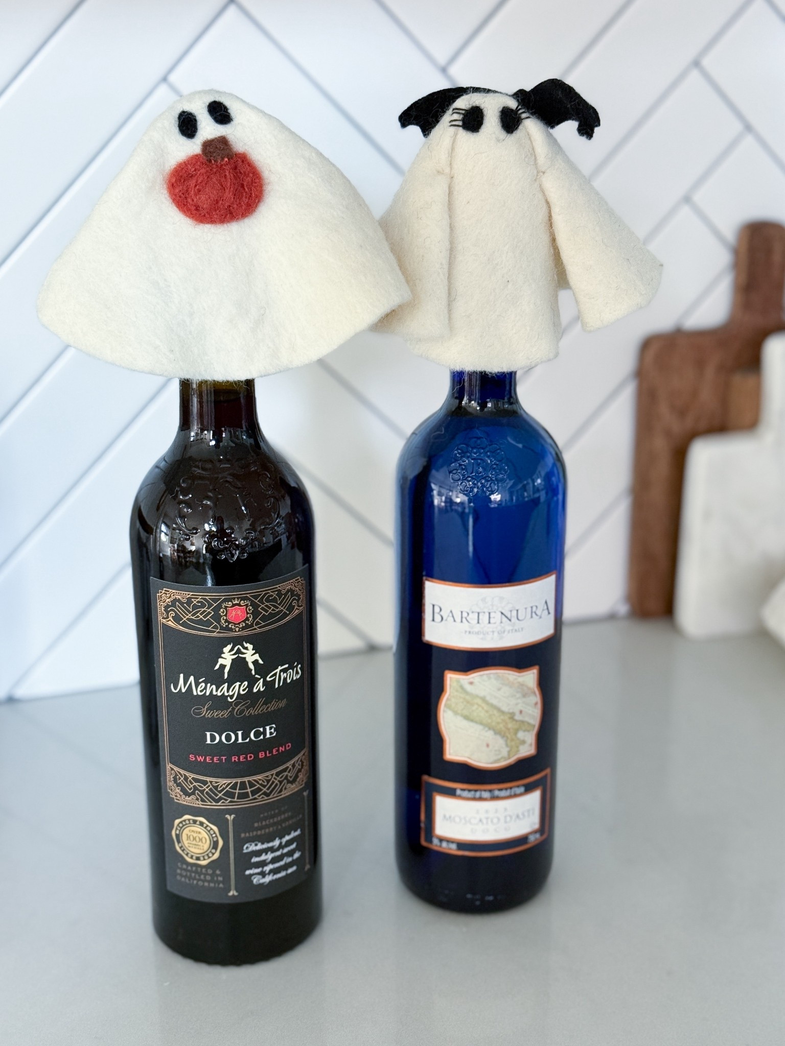 Pottery Barn really said “let’s make spooky adorable” & nailed it. Meet Gus and Mrs. Gus our new favorite Halloween house guests. These wool ghost bottle toppers are giving festive + functional. Perfect for dressing up a bottle of wine for a hostess gift or adding a cute little seasonal moment to your kitchen counter.

pottery barn ghost bottle toppers - gus and mrs gus - halloween wine bottle decor - wool wine toppers - halloween hostess gift - halloween wine gift - spooky wine bottle topper - ghost wine toppers - pottery barn halloween decor - cute halloween kitchen decor - halloween felt ghost - halloween wine bottle gift - pottery barn halloween ghost - halloween wine party decor - pottery barn gus ghost

#LTKHome #LTKParties #LTKSeasonal