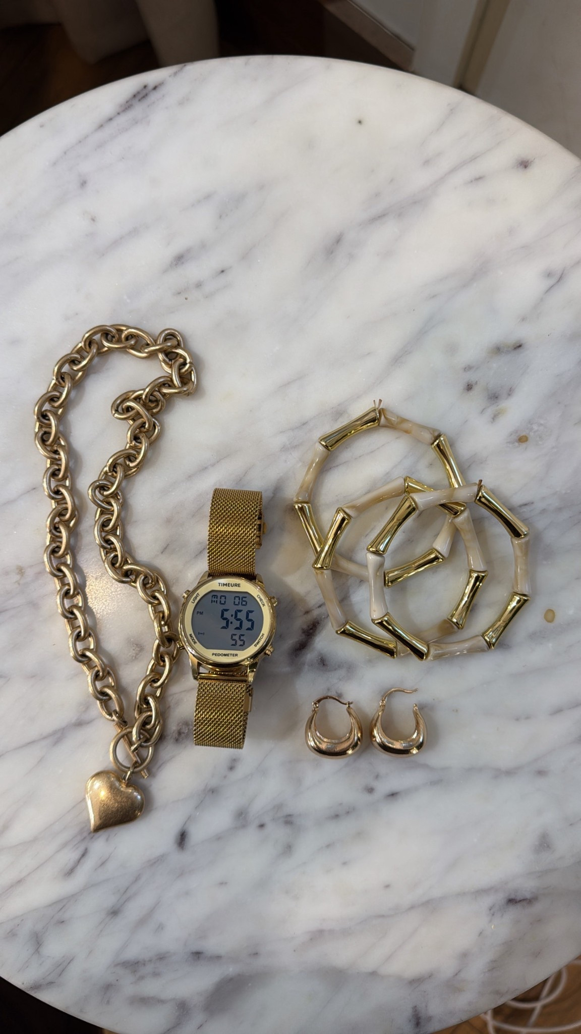 My everyday accessory stack vintagepickin gold jewelry viral women’s watch and pedometer step counter jewelry of the day paperclip necklace tube bracelets gold earrings charm necklace 

#LTKFindsUnder50 #LTKU #LTKStyleTip