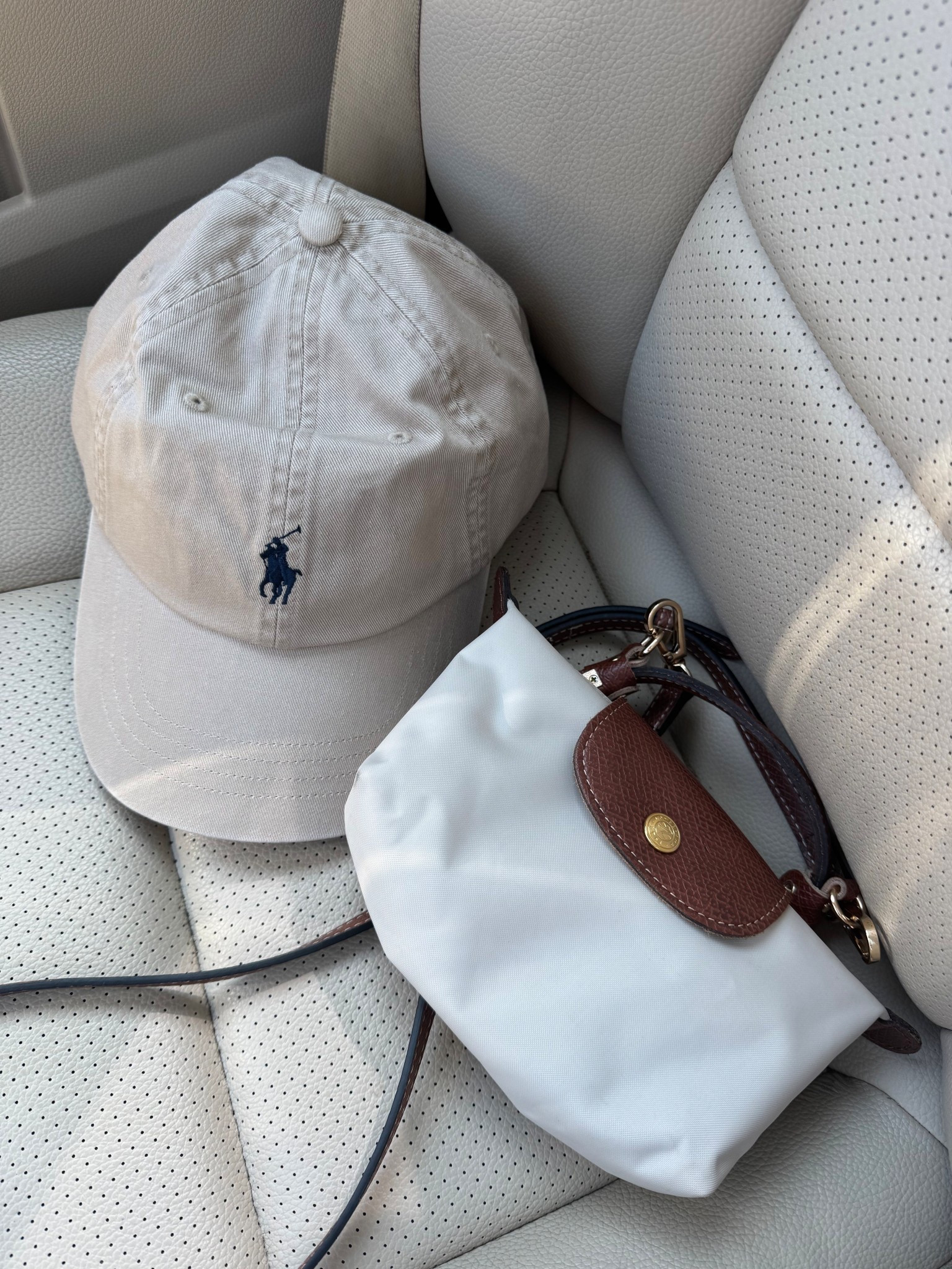 Ralph Lauren baseball cap and Longchamp “mini” cosmetic bag 