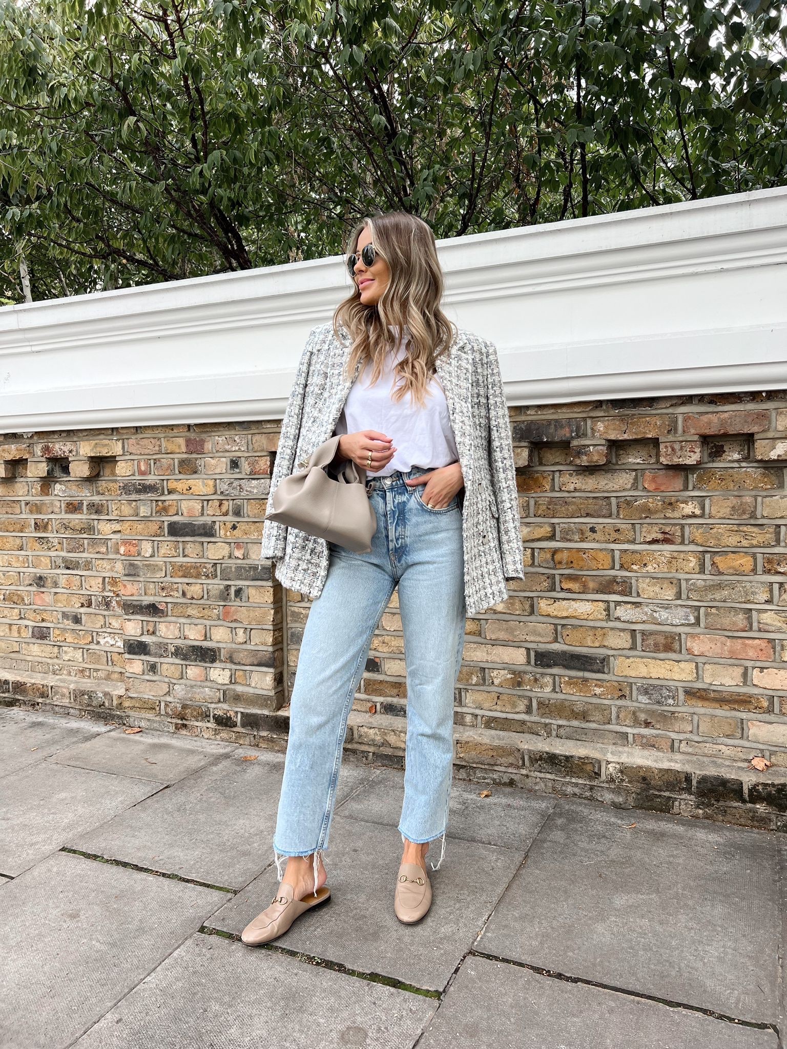 Early autumn street style look. Blue jeans, beige princetown loafers, white t shirt, beige handbag, rayban sunnies & check blazer  

#LTKstyletip #LTKshoecrush #LTKSeasonal