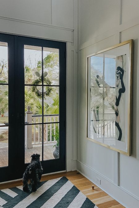 Always a fan of form meeting function - Loving this brass floor door stop in the entry foyer.  

#LTKhome