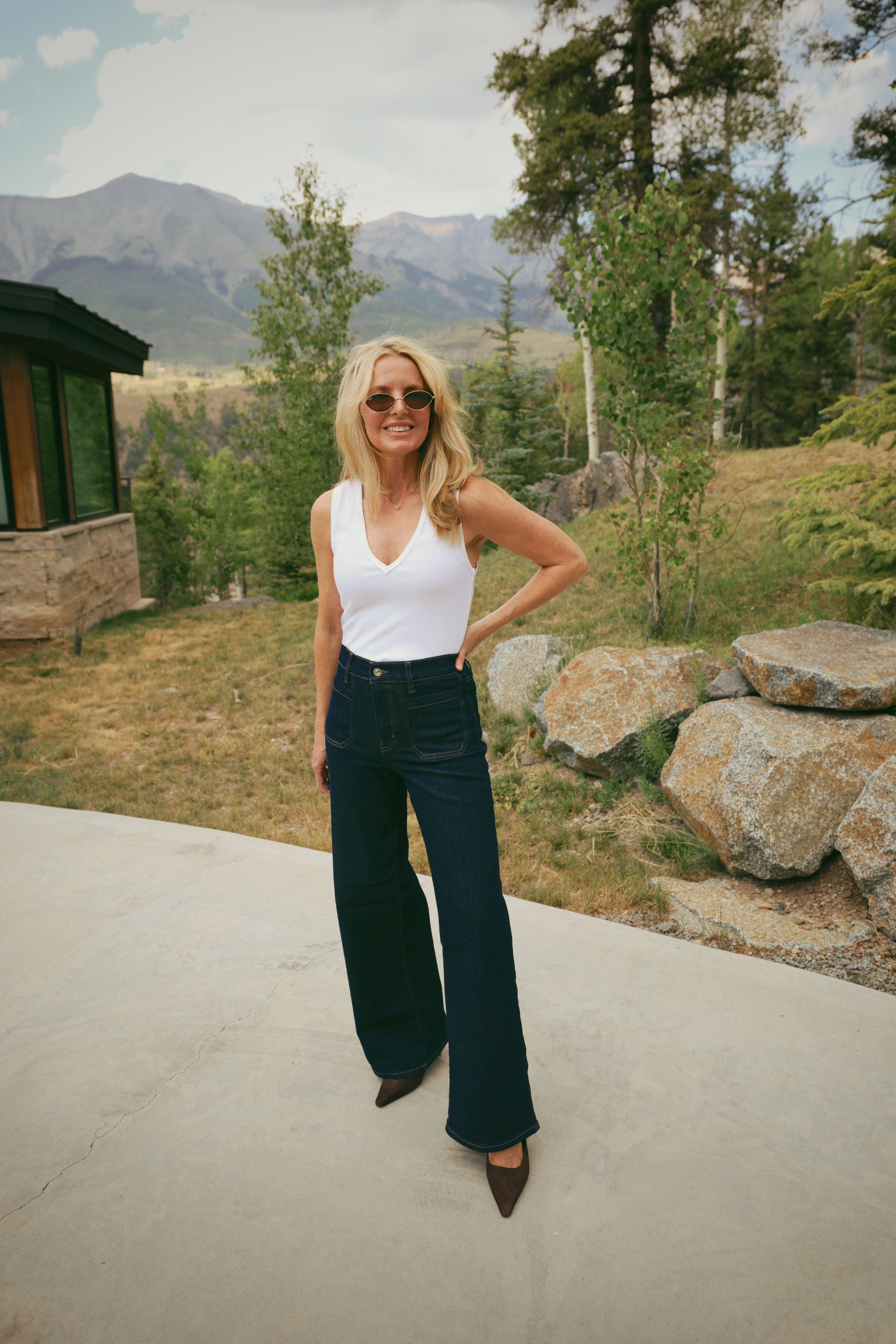 A white tank and dark wash wide leg jeans is the outfit formula that never fails!

The FRAME Le Slim Palazzo wide leg in dark wash has a high rise, patch front pockets, and a wide palazzo leg that creates the most beautiful long silhouette. Brown pointed toe heels and oval sunglasses; polished, easy, completely pulled together.

#LTKgrwm #LTKOver40 #LTKSaleAlert