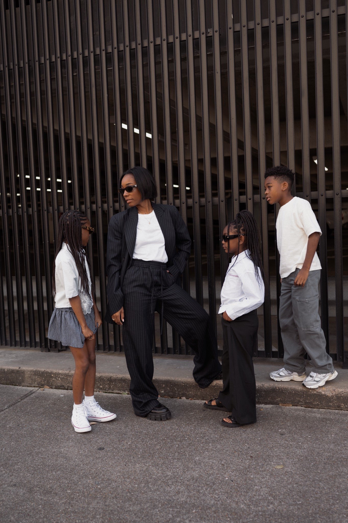 Family coordinating outfits- mom pinstripe blazer and trousers and comfy white crew neck tee. Girls trousers and button down, skirt. Sandals, new balance sneakers, high top converse, black sandals, boys grey jeans 

#LTKFamily #LTKKids #LTKShoeCrush