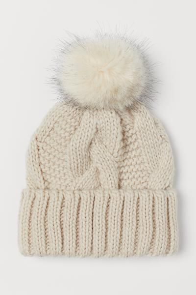 Cable-knit hat in a soft wool blend. Faux fur pompom at top and sewn, foldover cuff. | H&M (US + CA)
