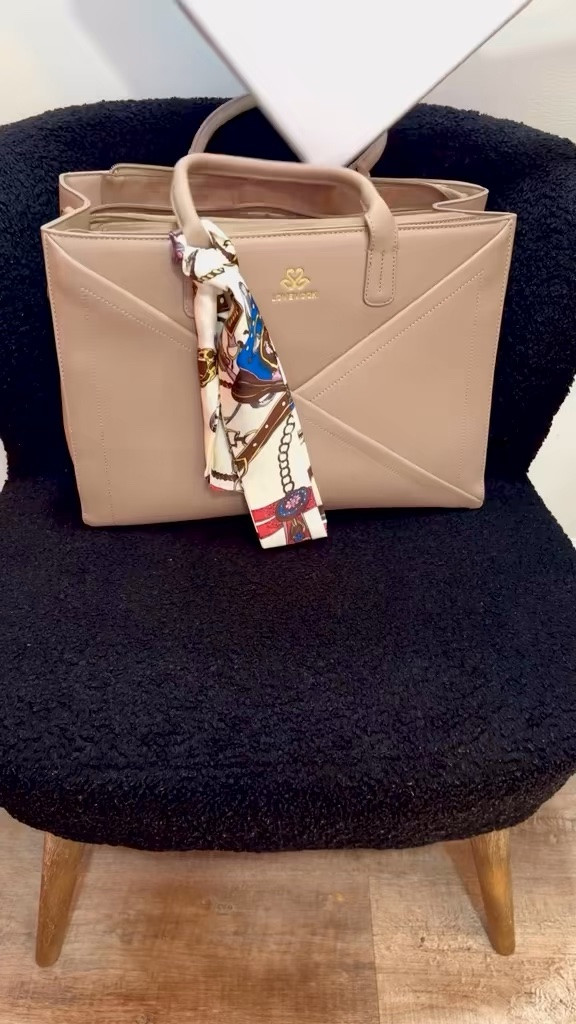 The bag I reach for every single trip. 🤎✨

As a busy mom, I need one bag that does it all—and this one delivers. It fits my laptop, travel essentials, snacks, and even has a built-in cup holder (which is a game changer!). Whether I’m heading to work, the airport, or a coffee shop, this tote keeps everything organized while still looking chic.

If you’re looking for a stylish, functional carry-all, this one’s worth adding to your collection. 👜✈️🤍

#LTKTravel #LTKWorkwear #LTKStyle #LTKFamily #LTKFind

#LTKTravel #LTKmomlife