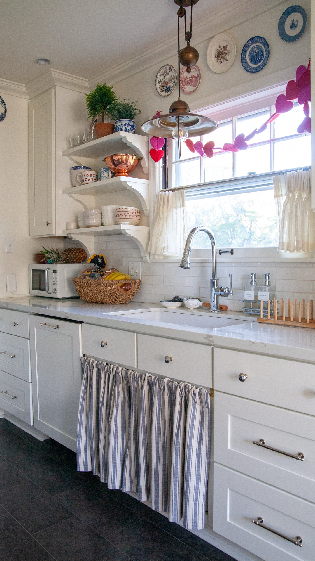 My home is lovely, but it’s not my dream, and it took me years of pining and feeling frustrated with its quirks, wishing for something different, and then I realized… I can love my home just the way it is, and still want something different in the future. It’s uncomfortable for me to not have a plan laid out, but with all the turns my life has taken the past few years, I’ve gotten a little more used to that.

I’m honestly so happy living in my home now. I’ve made the changes I could, never knocking down walls or doing a full renovation but starting with a foundation I liked (lots of warm white paint) and then adding beautiful details.

There’s no point feeling frustrated when it doesn’t make any sense for me to have bought my dream home at any point in my life thus far! But I can do so much, and feel so grateful, with what I have. 

Even if you can’t do anything to your home, not even paint, you can still hang a Valentine’s garland, pick out dishes that make you happy, get yourself some fresh flowers…! No need to wait for the perfect home.

#LTKmomlife #LTKHome #LTKSeasonal