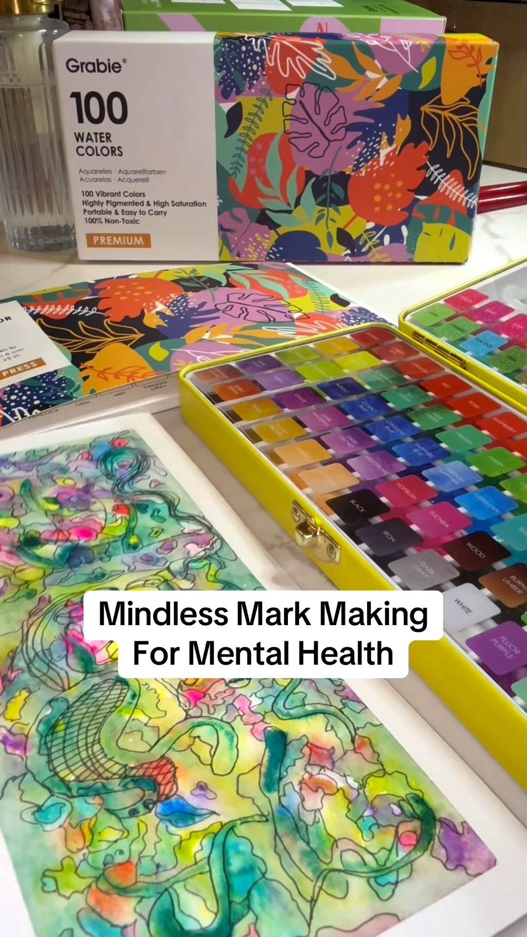 Watercolor is better for mindfulness than most guided exercises and I enjoy it much more than meditation because RAGING ADHD✨

Step 1: Watercolor paints, brushes, & paper Grabie has you covered on sale right now for a steal for 100 colors AND brushes AND paper!

Step 2: I use Washi tape and tape my border for a matted look

Step 3: activate your paint and wet the paper, and the lightest to darkest dab Wet-in-wet paint on the page howev Mark Making For Mental Health

Step 4: Dry fully, then ink any designs you

Step 4: Dry fully, then ink any designs you see or outline colors and changes or borders. Use patters. Fill the page or just do some. You are done when you want to be.

Uses: frame as is, add Acrylic marker for a card, use as scrapbook or junk journal paper, or give it away.

You deserve to make something beautiful and unique sith your mind

Be mindful: think about the things you see.

What fond place or thing do they remind you of? If it's nothing, how does your body feel when you allow it to explore without pressure?
Mindless Mark Making
@grabieofficial #watercolor-technique
#mindfulart #therapeutictiktok
#newhobbycheck

#LTKFindsUnder50 #LTKFallSale #LTKHome