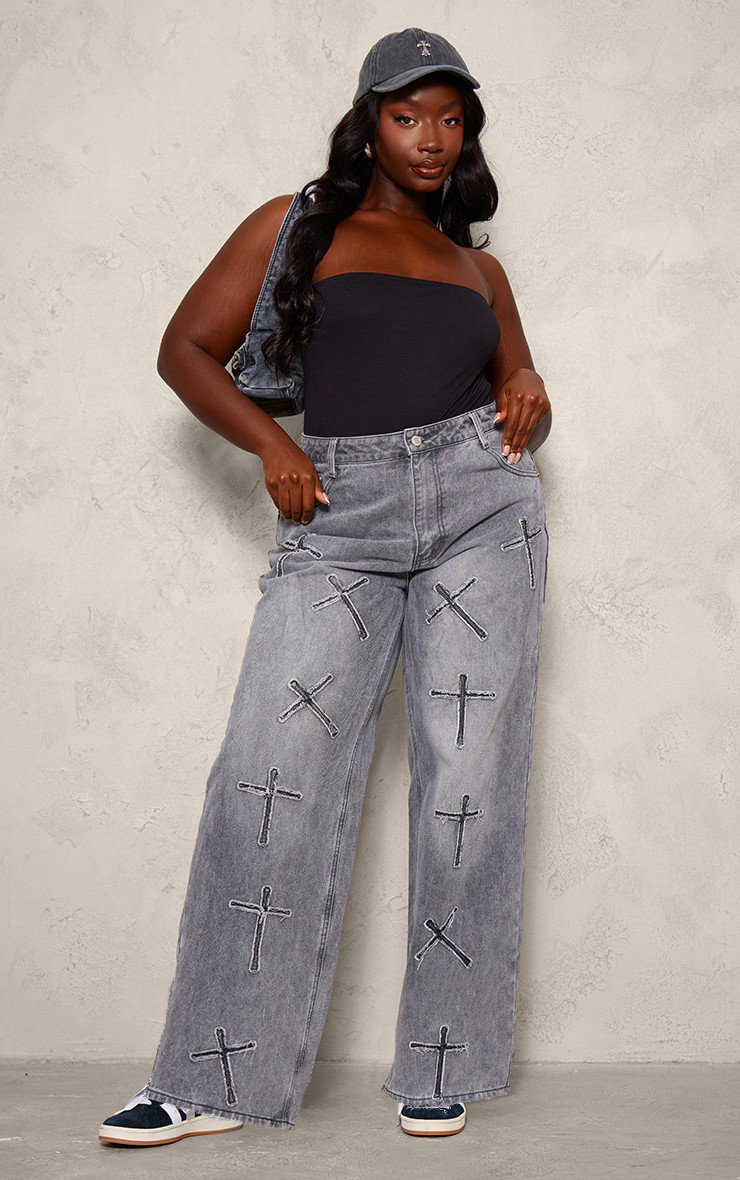 Plus Washed Black Cross Applique Detail Wide Leg Jeans | PrettyLittleThing UK
