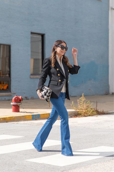 The perfect leg lengthening denim paired with a black blazer with gold buttons and black and ivory bag. Love this Veronica Beard look!

#LTKworkwear #LTKitbag #LTKstyletip