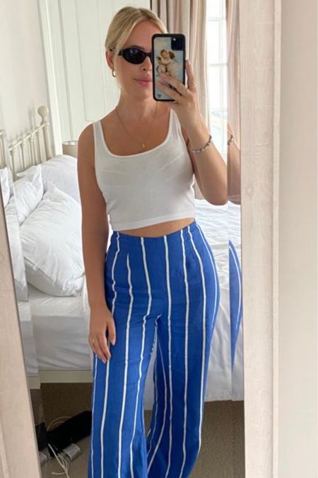 Cropped vest, white vest, cropped top, cropped cami, stripe trousers flare trousers, blue stripe trousers, black sunglasses, prada sunglasses, cat eye sunglasses, casual outfit, weekend outfit, Reformation, & Other Stories, Free People, Faithfull The Brand, Net-a-Porter, NA-KD, Prada, Le Specs

#LTKstyletip #LTKSeasonal #LTKeurope