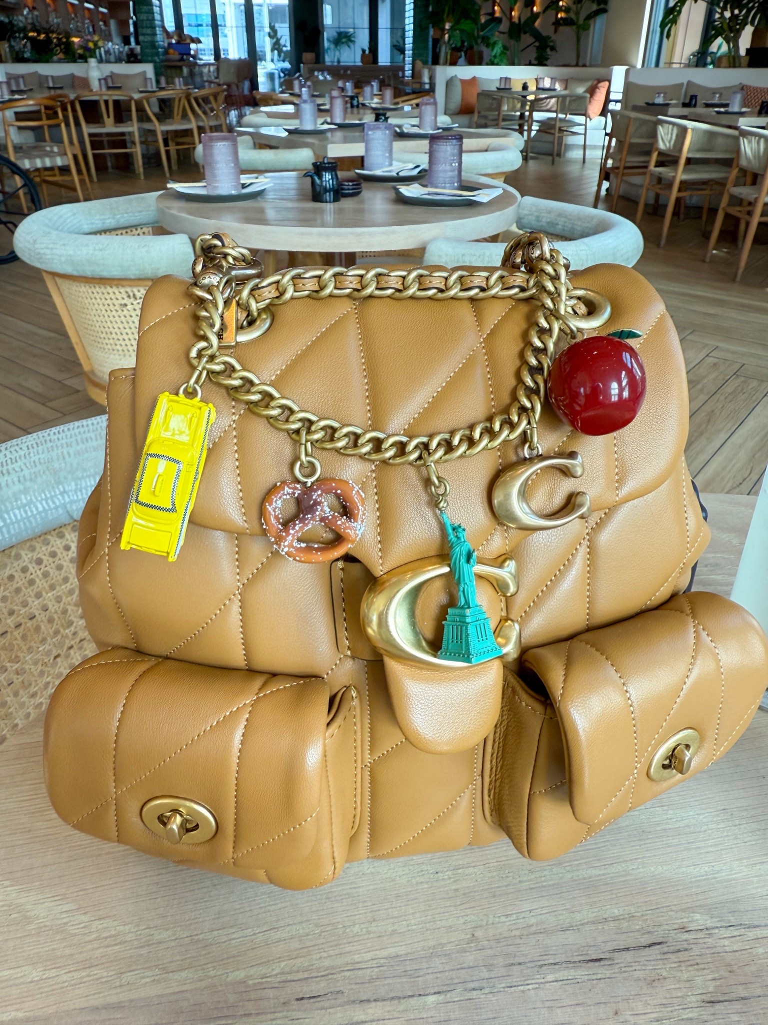This Coach Tabby Backpack has become my favorite travel bag. I’m from New York, so this charm was necessary. We can wear the charm on any bag in our closet!

#LTKTravel #LTKootd #LTKActive