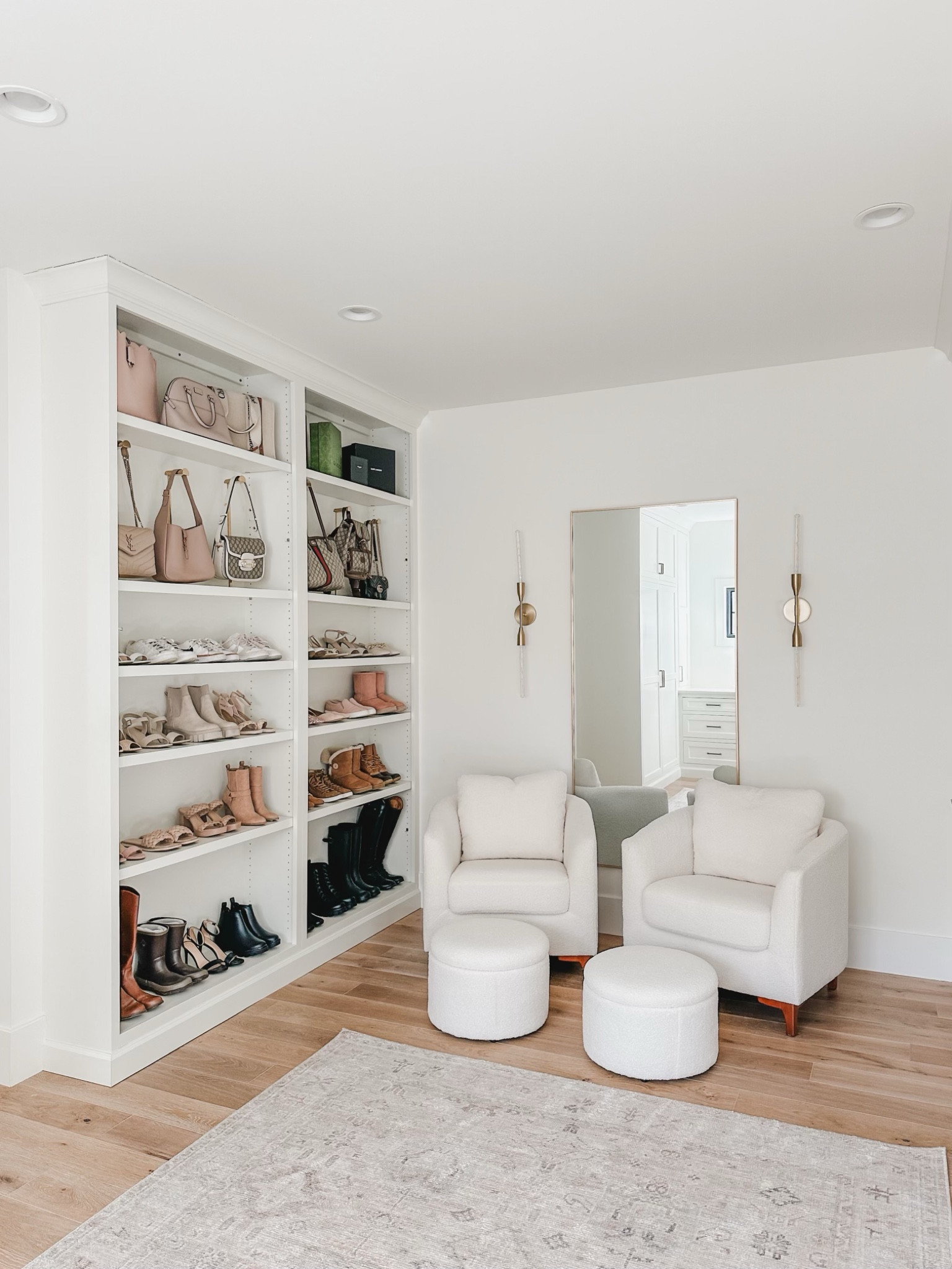 Recently added accent chairs to my closet with hidden storage - so glad I did! These chairs add the perfect cozy touch and fits in perfectly 

Home organization, primary bedroom closet, lighting detail, gold detail, accent chair, sherpa chair, area rug, Becki Owens, vintage inspired rug, open shelving, aesthetic closet, shoe organization, Amazon Prime, found it on Amazon, purse hooks, spring refresh, creamy whites, natural wood tone, home aesthetic, shop the look!

#LTKhome #LTKstyletip #LTKSeasonal