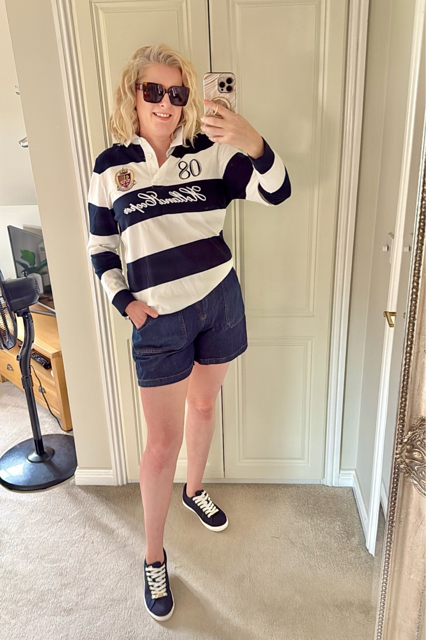 Hi everyone! I love timeless fashion & this outfit certainly is one I’d wear year in year out. 
I love rugby shirts, they’ve been around for as long as I can remember & can be worn with jeans, joggers, chinos or shorts like I’m wearing myself. This one is navy & white stripe but also available in pink. Stock is low, however if you sign up they’ll notify you when restocked. 
Trainers are also navy & white & perfect for spring/summer. Holland Cooper is definitely a British brand than will get a lot of wear for years. 
Glasses are classic Gucci. I’m wearing brown but also available in black. 

U.K. fashion blogger, smart casual, tall, midsize, over 40, designer, luxe, luxury.

#LTKluxury #LTKstyletip #LTKshoes