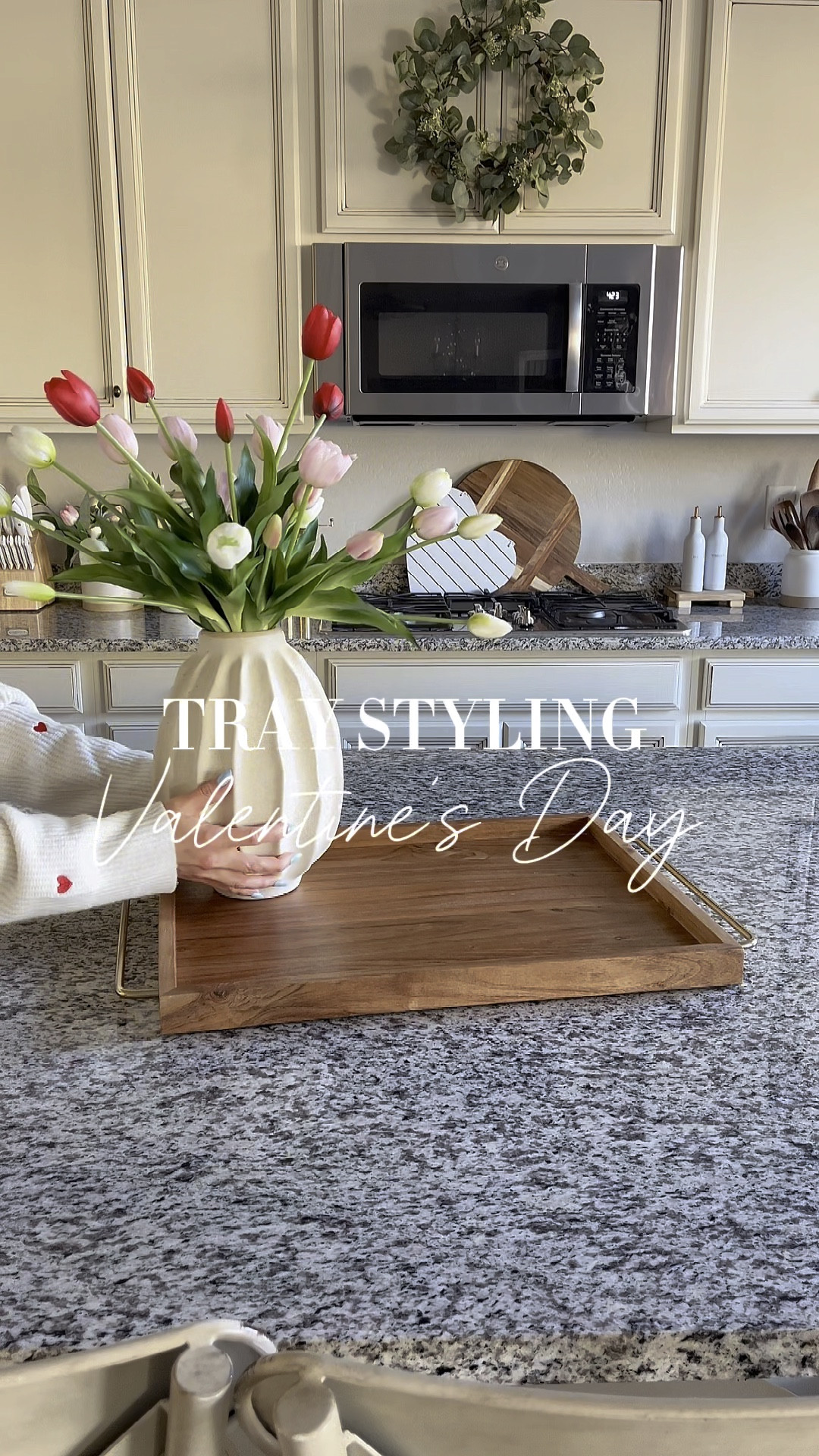 Tray styling, VALENTINE’S DAY!  Follow @lifeinmyarizonahome on Instagram for more inspiration. 

These beautiful tulips are so realistic looking. Each color comes in a set of two bunches. I separated the bunches for easier styling. I love the gorgeous detail on the heart plates. They come in a set of 10 so I will use the other half of them in my coffee bar  

Wood handled tray | wavy vase | real touch tulips | glass candle holder | luminara flameless heart candle | wood heart decor | heart towel | white heart plates 

#valentinesdecor #traystyling 

#LTKSeasonal #LTKHome #LTKWatchNow