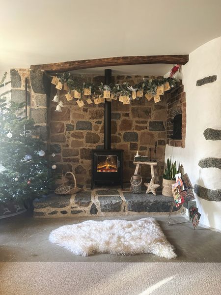A very rustic, cosy hygge Christmas fireplace. Check out this activity advent - we do it every year with Kraft envelopes 

#LTKhome #LTKHoliday #LTKSeasonal