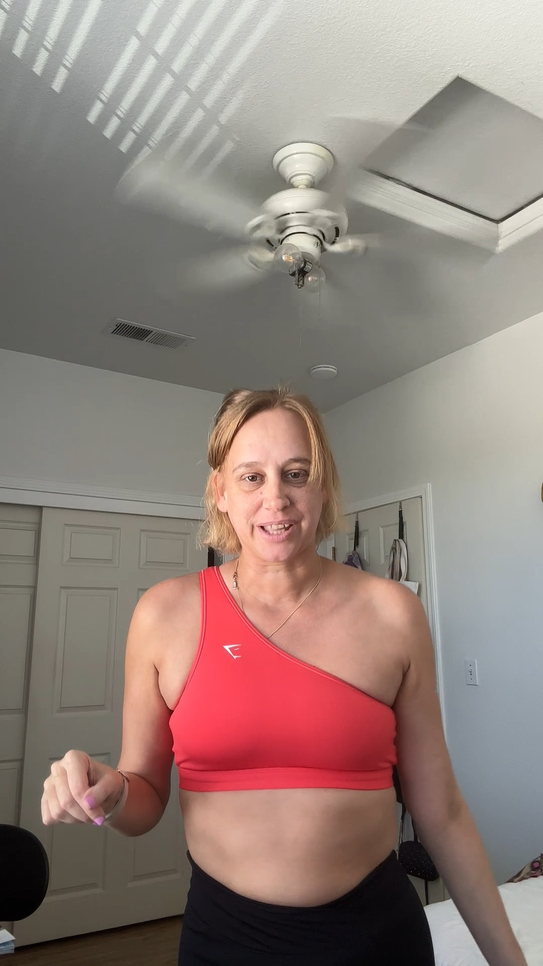 Asymmetrical one shoulder sports bra in coral 
Criss cross front with back ruching biker shorts 

#LTKSeasonal #LTKActive #LTKSaleAlert