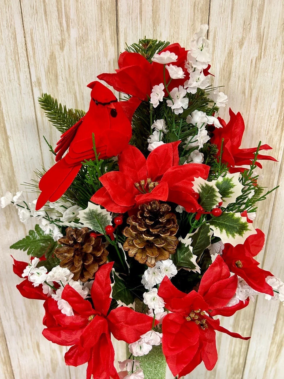 Honor loved ones with a thoughtful seasonal tribute from kellysflorals. This beautifully crafted Christmas arrangement features red and white silk blooms, holly, pine cones, and a meaningful red cardinal accent, creating a heartfelt display for mausoleums, crypt vases, or gravesites. Designed as a one-sided arrangement and measuring approximately 14” tall, it includes a trim-to-fit foam insert for easy placement. Available only through December 10, 2025, making it a special way to share holiday remembrance. #EtsyFinds #MemorialFlowers #ChristmasArrangement #RedCardinal #HolidayTribute #LTKHoliday #LTKHomeDecor #kellysflorals

#LTKSeasonal #LTKHoliday #LTKHome
