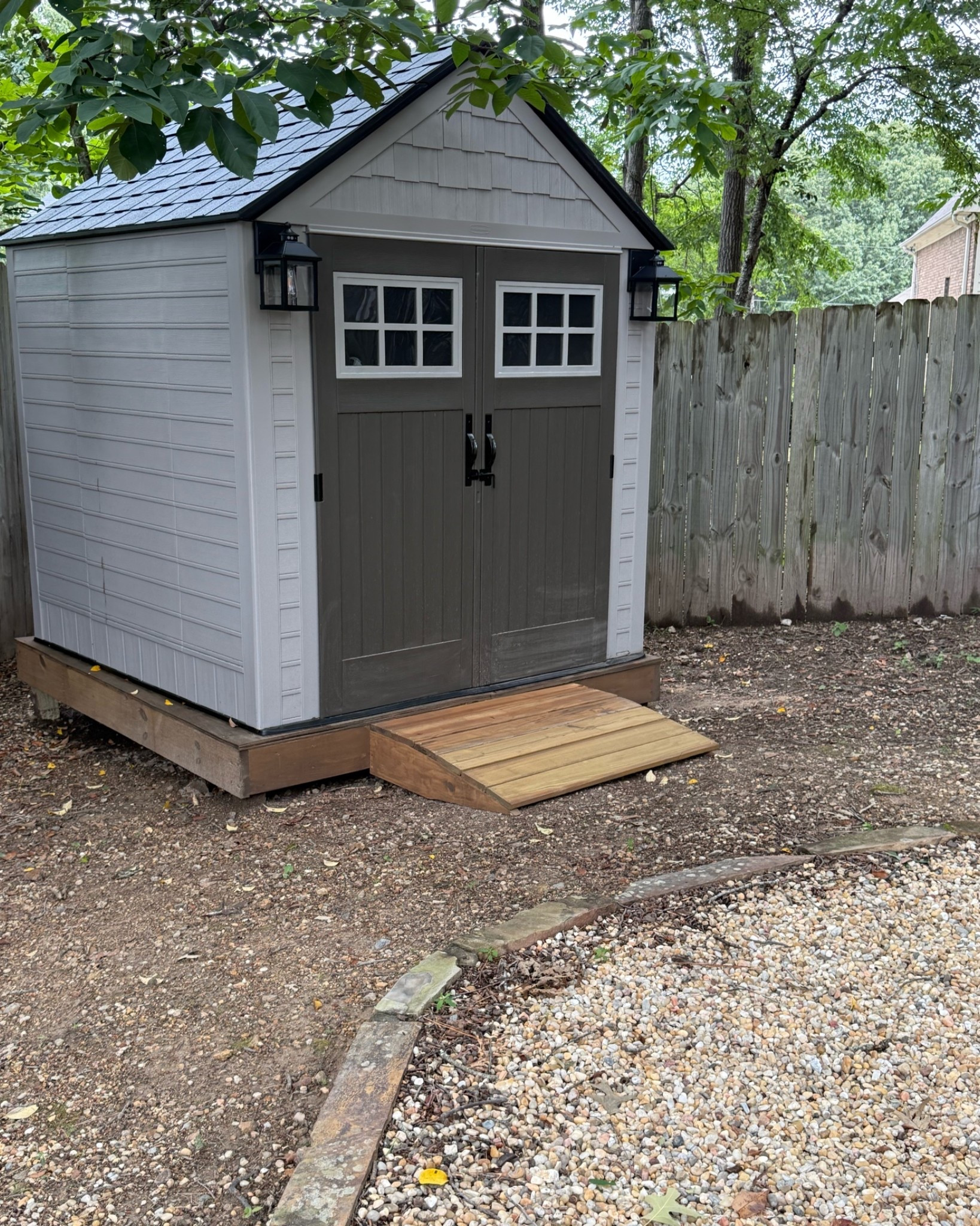 Our storage comes in two sizes 
I have the 7x7
Having a level surface to install it on is crucial. This part of our yard is on a slight slope, so we had a little “mini deck” built to install the shed on. 

Once fully assembled, I secured the shed floor to the decking with lag screws. 

The lights I installed on the outside are solar powered, have a warm white light and have three lighting modes.

#LTKSeasonal #LTKHome #LTKmomlife
