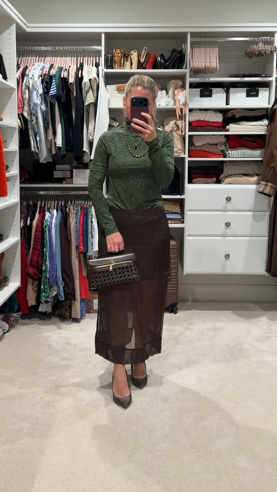 Earthy holiday outfit built around rich espresso tones and deep olive. This sheer midi skirt and matching espresso heels feel elevated but still easy for events, dinners, or holiday parties. I love mixing warm neutrals with soft texture for a timeless winter look.

Styling tip: For colder days, wear Noosh tights underneath. They look sheer but keep you warm so you can still wear skirts and dresses all season without sacrificing comfort.

Linking this outfit plus similar olive tops, espresso skirts, classic holiday heels, and winter layering staples. Perfect for holiday outfits, elevated basics, capsule wardrobe styling, and chic winter neutrals.

#LTKSeasonal #LTKootd #LTKHoliday