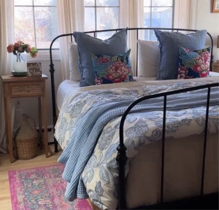 Master Bedroom Spring refresh. Using blues, creams and pinks. Metal bed, rattan shades, linen curtains, waffle weave blanket and floral quilt. 


#LTKFindsUnder100 #LTKStyleTip #LTKHome