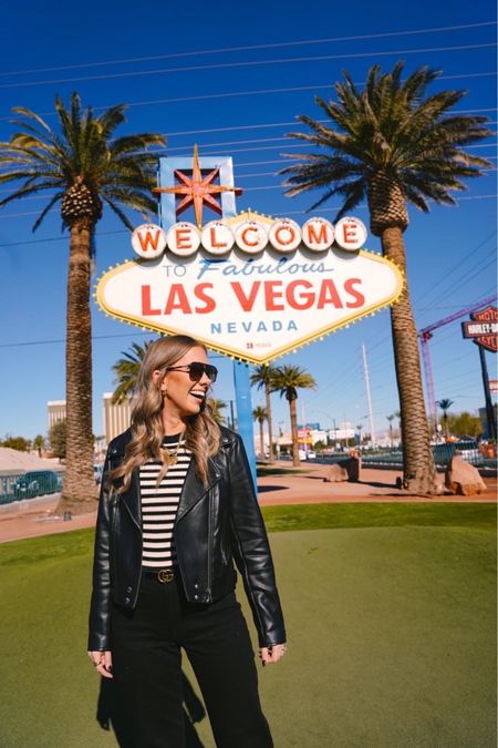 Vegas vibe! This top has a shimmer of gold. Wearing a small, and these black jeans are a tall girl's dream at 5'8. Loving the perfect length! Paired with a faux leather moto jacket, The Best Day Necklace, and high key shades from quay. 🌟 

Don't miss out on Gap's sale – 40-60% off on jeans, sweats, and more!

Las Vegas
Travel Outfit
City Outfit
Leather Jacket
Converse
Denim
Vacation

#LTKtravel #LTKstyletip #LTKGiftGuide