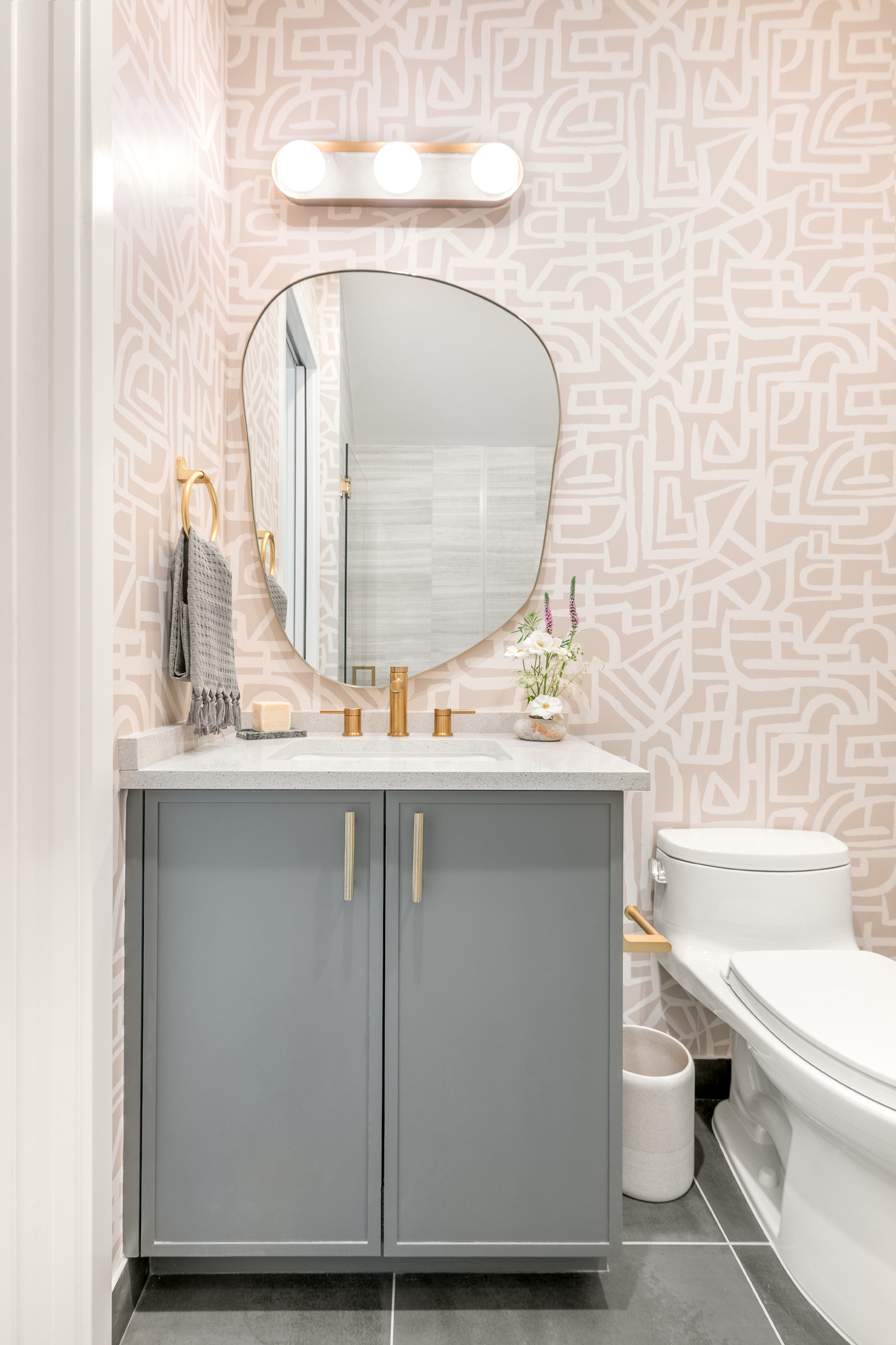 The Boca Raton Essex House, introducing the bathrooms—proof that you don’t need a full gut renovation to make a big impact. These spaces strike that sweet spot between keeping what works and elevating where it counts. We kept several of the builder-grade elements in place, then layered in a few simple upgrades like fresh lighting, updated mirrors, and wallpaper in just the right spots. It’s all about the mix—high and low, clean and cozy—coming together to create something that feels intentional, elevated, and totally livable. 

 #LTKHome